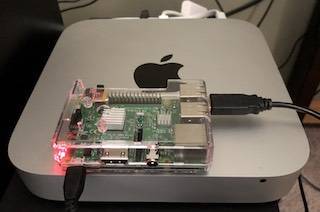 Image of the new Raspberry PI Weather Server sitting on top of the old Mac Mini