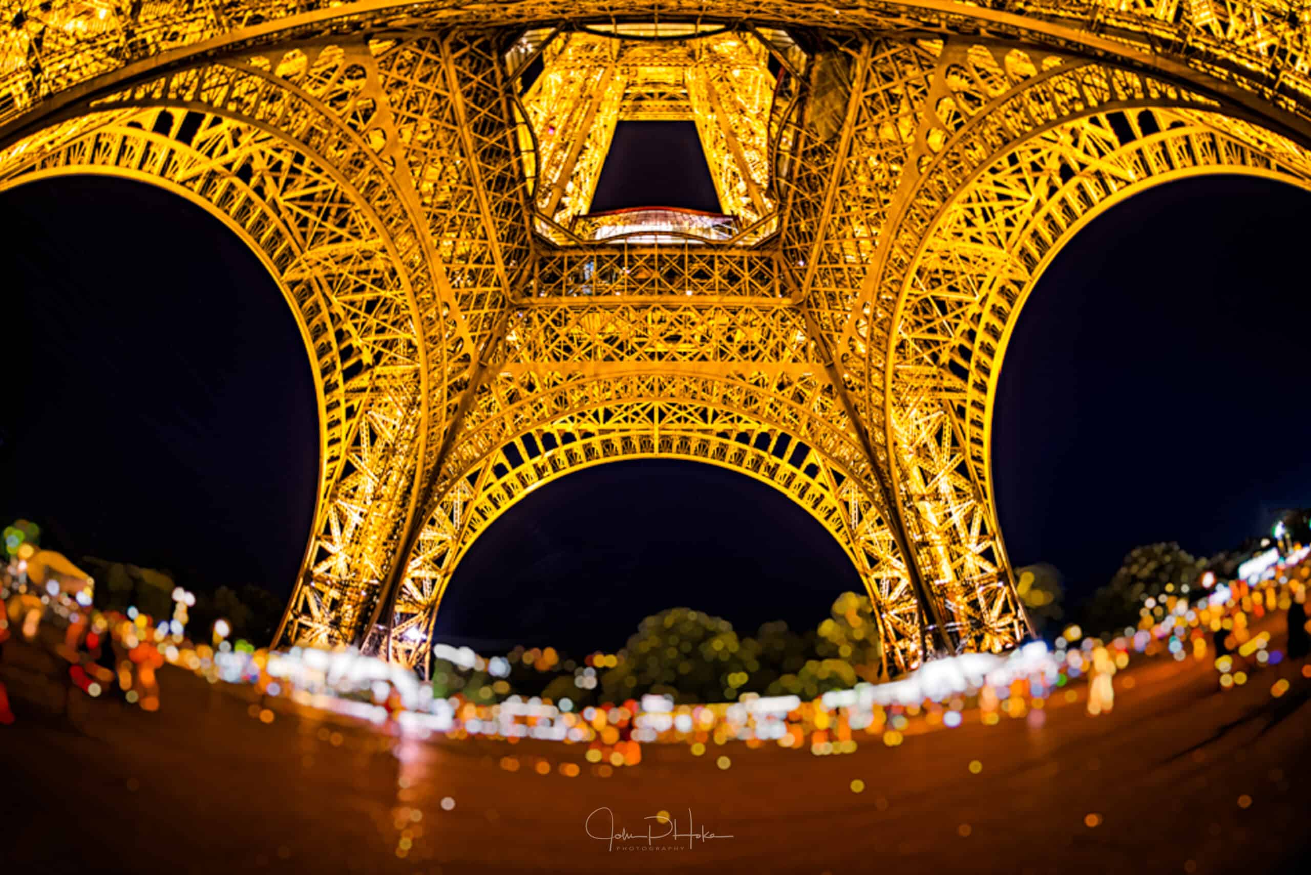 Image of the Eiffel Tower at night through a wide angle fisheye lens