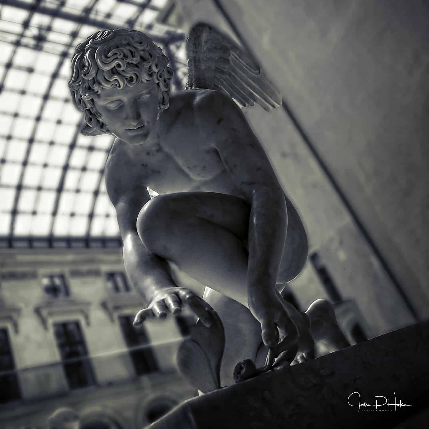 Paris - Louvre - Black and White image of an angel kneeling before a rose
