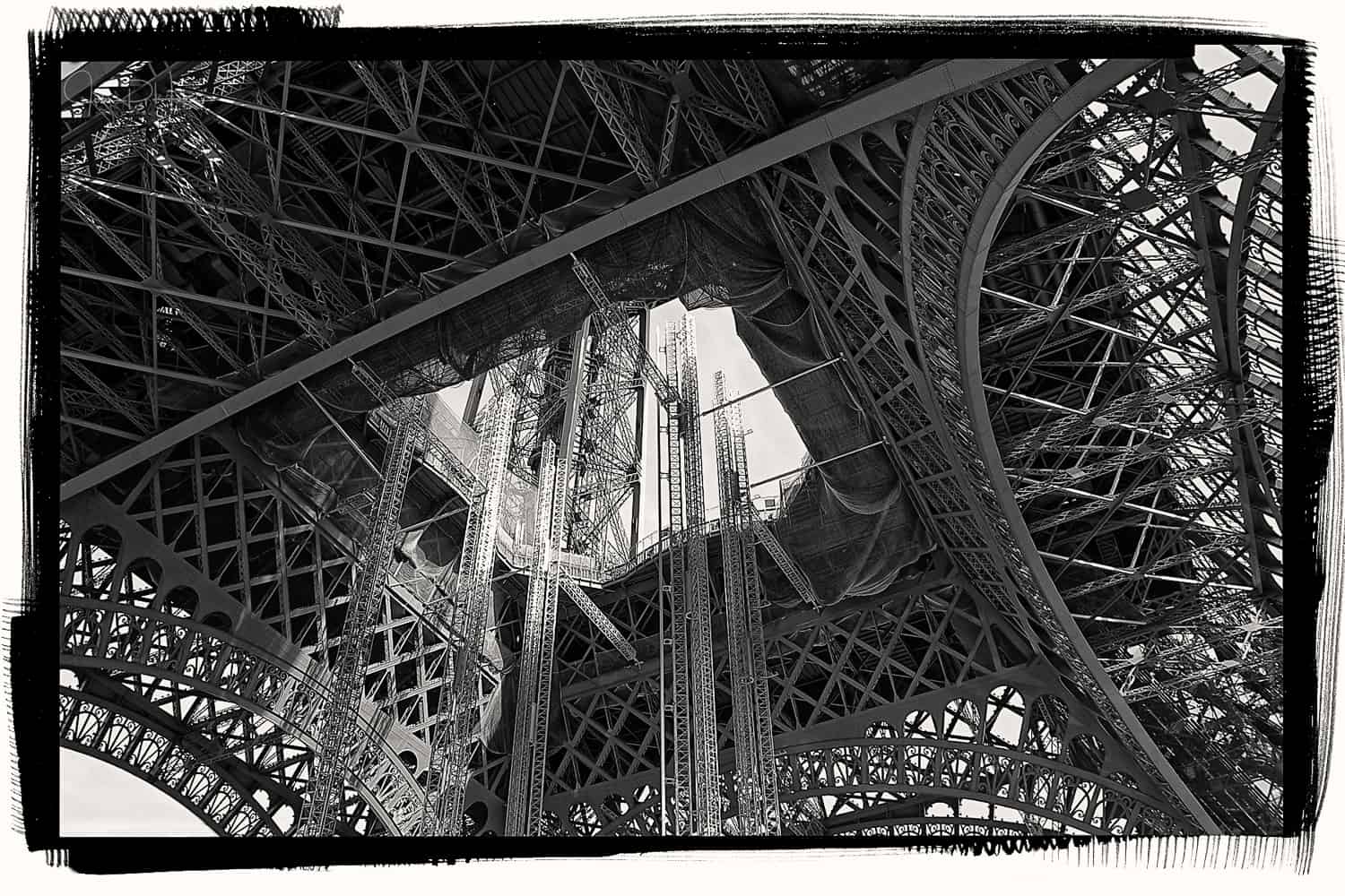 Black and White image of scaffolding during repairs and maintenance to the Eiffel Tower, Paris France