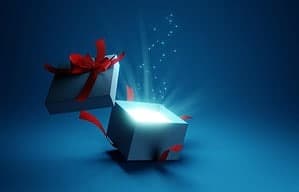Gift Box opened with light spilling out from inside